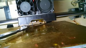 How to check the depth of clearance on a printhead with a feeler guage